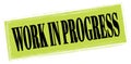 WORK IN PROGRESS text written on green-black stamp sign Royalty Free Stock Photo