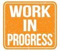 WORK IN PROGRESS, text written on orange stamp sign Royalty Free Stock Photo