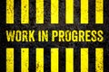 Work in progress warning sign with yellow and black stripes as concept for Under Construction Royalty Free Stock Photo