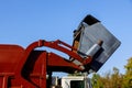 Work of public services for loading household waste from the container into the car Royalty Free Stock Photo