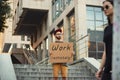 Dude with sign - man stands protesting things that annoy him