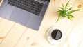 Work remotely. A workspace with a laptop, a blank notepad, a coffee mug, and a Royalty Free Stock Photo