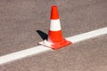 Work on road. Construction cone. Traffic cone, with white and orange stripes on asphalt. Street and traffic signs for signaling. Royalty Free Stock Photo