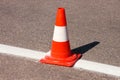 Work on road. Construction cone. Traffic cone, with white and orange stripes on asphalt. Street and traffic signs for signaling. Royalty Free Stock Photo