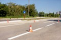 Work on road. Construction cones with traffic sign keep right sign. Traffic cones, with white and orange stripes on asphalt. Royalty Free Stock Photo