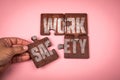 WORK SAFETY Concept. Wooden puzzle pieces with text on pink background Royalty Free Stock Photo