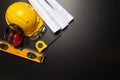 Work safety. Construction site protective equipment on wooden background, flat lay, copy space, top view Royalty Free Stock Photo