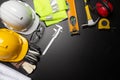 Work safety. Construction site protective equipment on wooden background, flat lay, copy space, top view Royalty Free Stock Photo