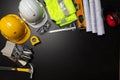 Work safety. Construction site protective equipment on wooden background, flat lay, copy space, top view Royalty Free Stock Photo