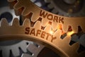 Work Safety on Golden Metallic Cogwheels. 3D Illustration. Royalty Free Stock Photo