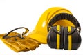 Work safety and safety industrial equipment concept protective ear muffs, safety goggles, suede gloves and yellow helmet or hard Royalty Free Stock Photo