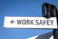 Work Safety. White signpost and blue sky Royalty Free Stock Photo