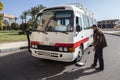 Hurghada, Egypt - December 2016: A security guard checks the bus before entering the hotel.