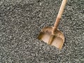 Work - Shovel in a pile of crushed stone