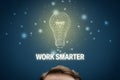Work smarter motivation concept with light bulb Royalty Free Stock Photo