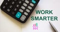 work smarter textt with pen, calculator and graph Royalty Free Stock Photo