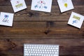 Work in social media. Media marketing. Desk with keyboard and socail media icons. Dark wooden background top view copy