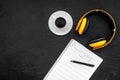 Work space of composer or dj with headphones and notes black background top view mock-up Royalty Free Stock Photo