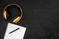 Work space of composer or dj with headphones and notes black background top view mock-up Royalty Free Stock Photo