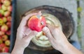 Making of apple vinegar - scene from above - hand peeling apples