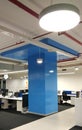 Work station with round ceiling lights in an information technology company.