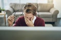 Work stress - the struggle is real. a young man suffering from stress while using a computer at his work desk.