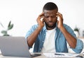 Work Stress. Tired Black Businessman Suffering Headache At Workplace In Office Royalty Free Stock Photo