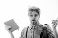 Surprised handsome man in nerd glasses holding pen and notebook Royalty Free Stock Photo