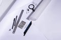 Work table of an architect with blank paper, magnifying glass, ruler, pencils, pens and clips. Architect ready to start work. In b Royalty Free Stock Photo