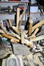 Work table of a carpenter with many tools olds hanging Royalty Free Stock Photo