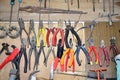 Work table of a carpenter with many tools olds hanging Royalty Free Stock Photo