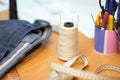 Work table seamstress details, thread, centimeter and other sewing tools. vintage sewing machine factory sewing Close-up Royalty Free Stock Photo