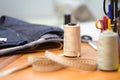 Work table seamstress details, thread, centimeter and other sewing tools. vintage sewing machine factory sewing Close-up Royalty Free Stock Photo