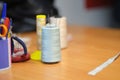 Work table seamstress details, thread, centimeter and other sewing tools. vintage sewing machine factory sewing Close-up Royalty Free Stock Photo