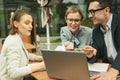 Work team having meeting at cozy cafe at street Royalty Free Stock Photo