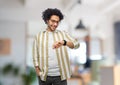 smiling man in glasses with smart watch at office Royalty Free Stock Photo