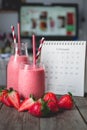 Work time with strawberry smoothie with work place background Royalty Free Stock Photo