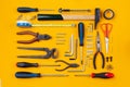 Work tools arranged on an orange background Royalty Free Stock Photo