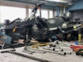 Work tools on table. Service snow snowmobile in the service center. Winter adventures on intro. Surgut, Russia - 24 October 2021.