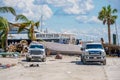 Work trucks clearing out debris from Fort Myers FL Hurricane Ian aftermath scene