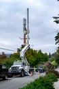 Work trucks and crews installing 5G, new technology, wireless communications cell site