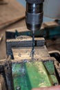 Work in the workshop and drill a hole with the drill Royalty Free Stock Photo