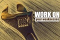 Work on your weaknesses phrase on a background with wrench key - inspiration and motivation Royalty Free Stock Photo