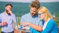 Workaholics concept. Colleagues with laptop work outdoor sunny day, nature background. Couple works despite of coffee