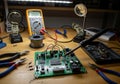 Multimeter with probes is in the background, measuring electrical Royalty Free Stock Photo