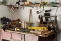 A workbench in the workshop with different parts and tools. Royalty Free Stock Photo