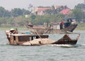 Workboats on the Perfumed River in Hue, Vietnam Royalty Free Stock Photo