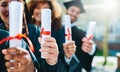 We worked hard and got results. a group of students holding their diplomas on graduation day. Royalty Free Stock Photo