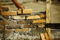 Worker adjusting cemented bricks structure Royalty Free Stock Photo