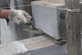 Worker aligns with a spatula, lay brick cinderblocks Royalty Free Stock Photo